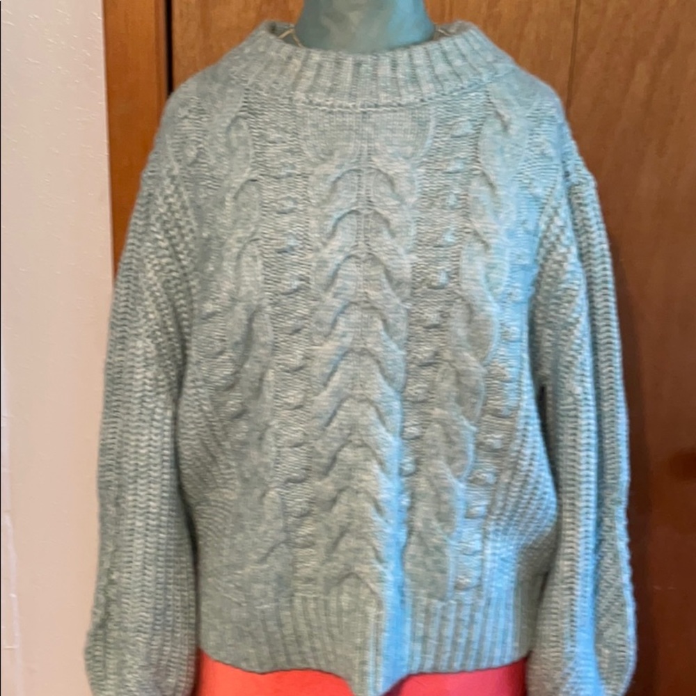 Pale blue and white acrylic sweater medium